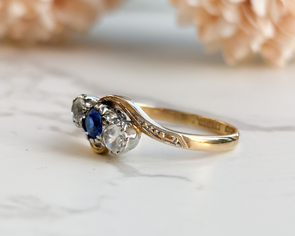 antique bypass ring with blue and white stones in 18ct gold for sale in Leeds, side view