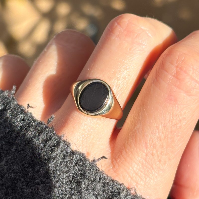 vintage onyx signet ring in 9ct gold dated 1972 for sale in Leeds, shown on woman's hand