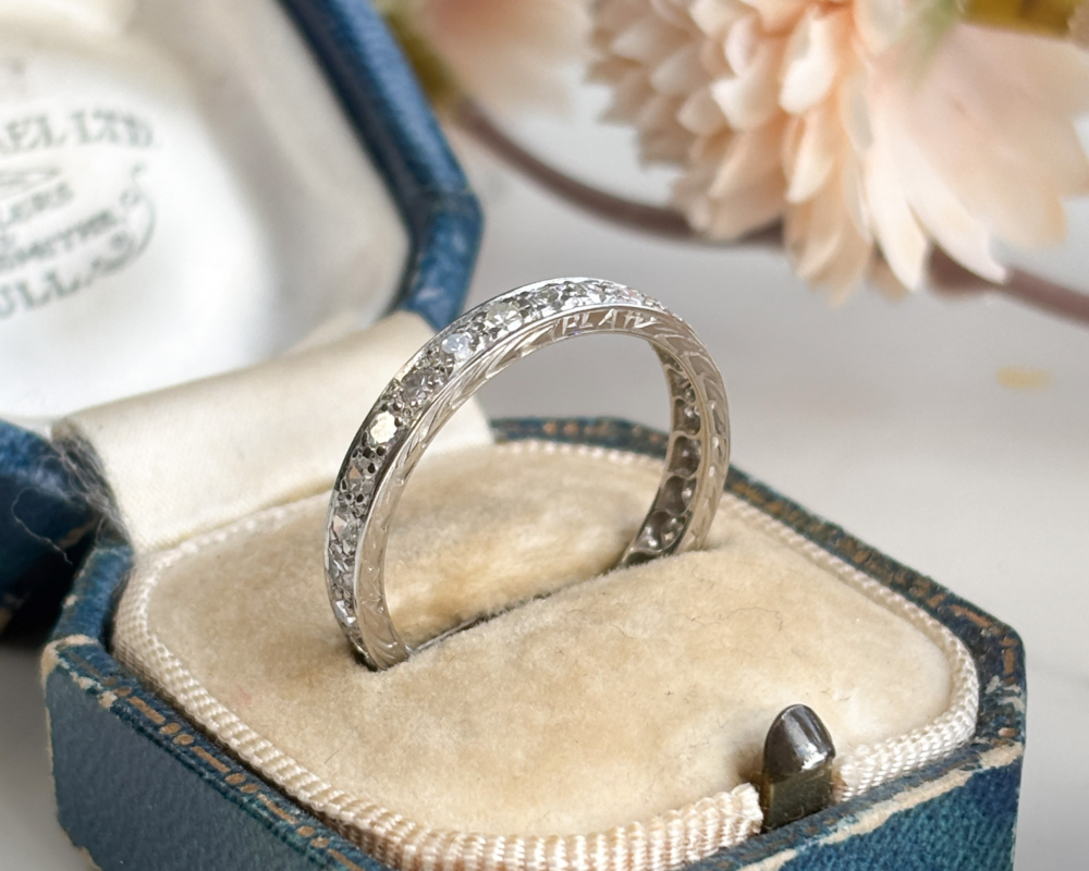 antique Art Deco diamond full eternity ring in platinum for sale in Leeds. Shown in an antique blue box