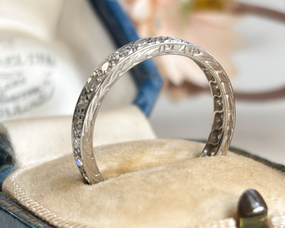antique Art Deco diamond full eternity ring in platinum for sale in Leeds. Shown in an antique blue box