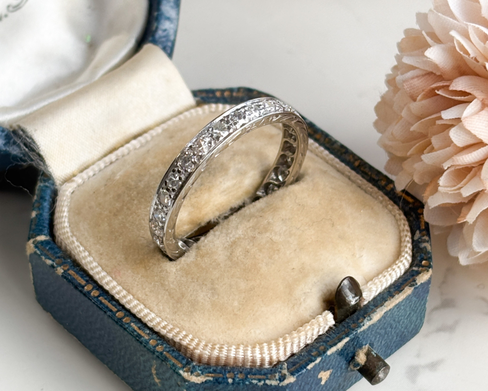 antique Art Deco diamond full eternity ring in platinum for sale in Leeds. Shown in an antique blue box