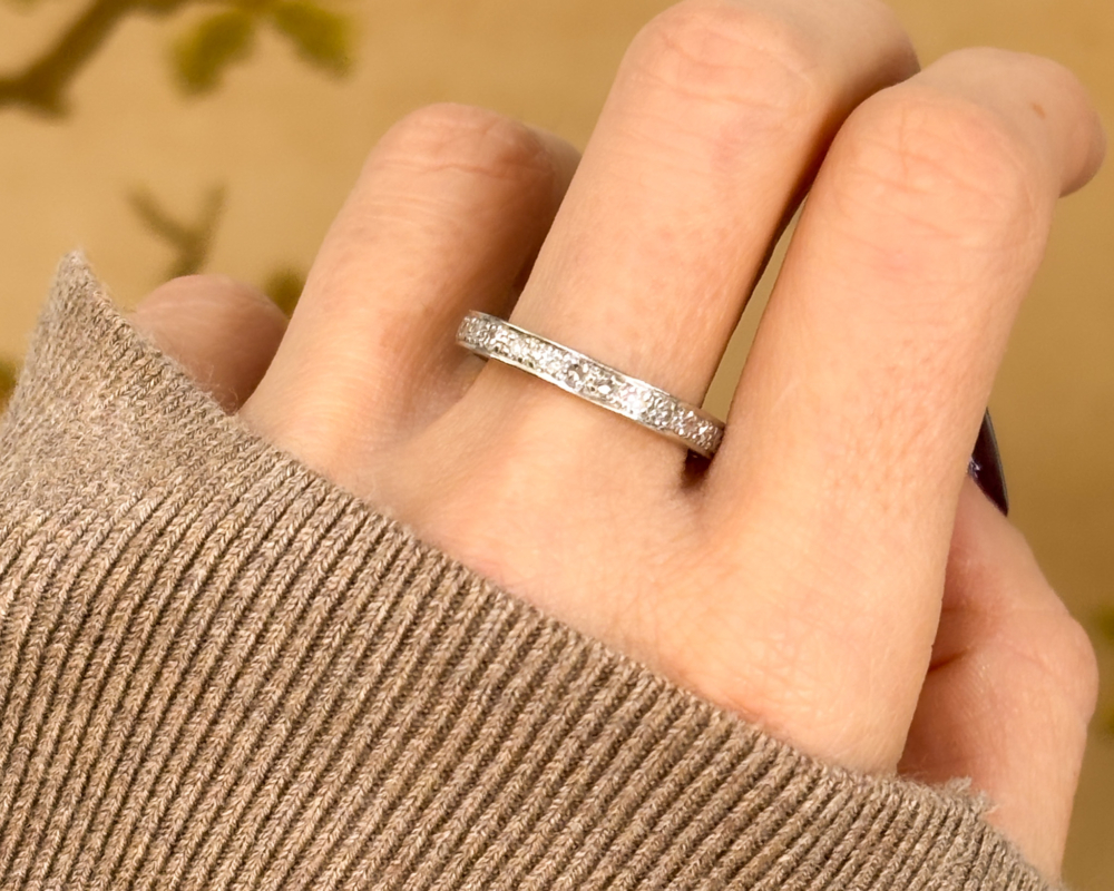 antique Art Deco diamond full eternity ring in platinum for sale in Leeds. Shown on a woman's hand
