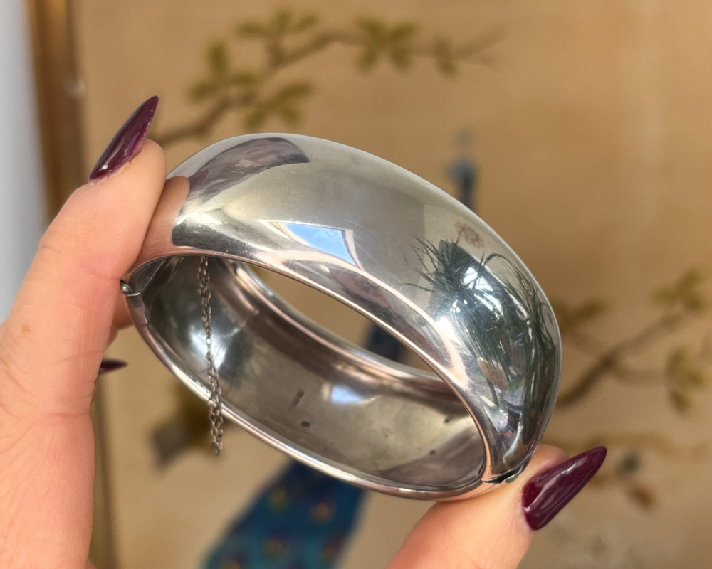 antique Victorian silver bangle with floral pattern engraved. for sale in Leeds, UK, showing the plain back of the bangle