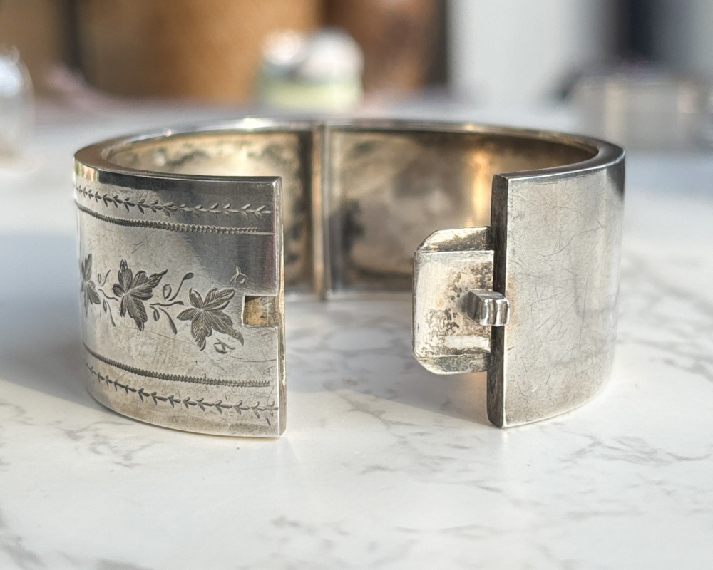 Victorian silver bangle depicting rural church scene for sale, showing bangle open