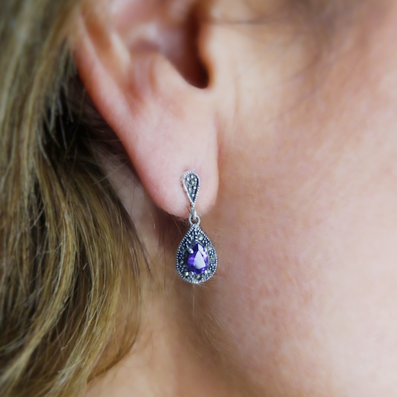 vintage style silver, marcasite and amethyst drop earrings for sale, shown in woman's ear