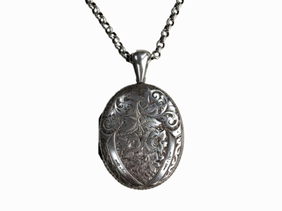 antique Victorian silver locket on a silver belcher chain.