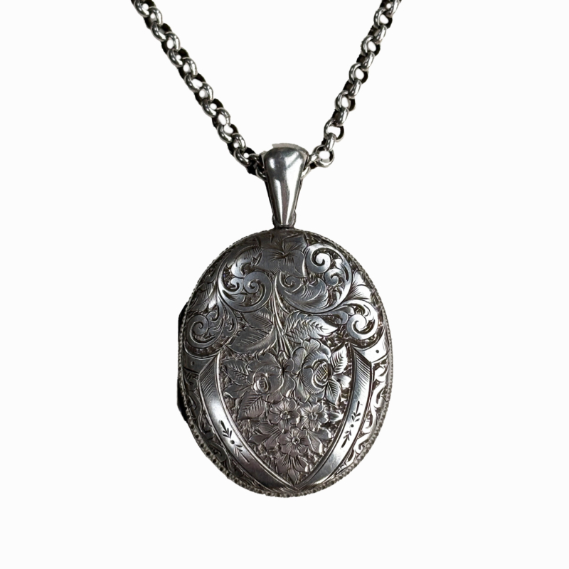 antique Victorian silver locket on a silver belcher chain.