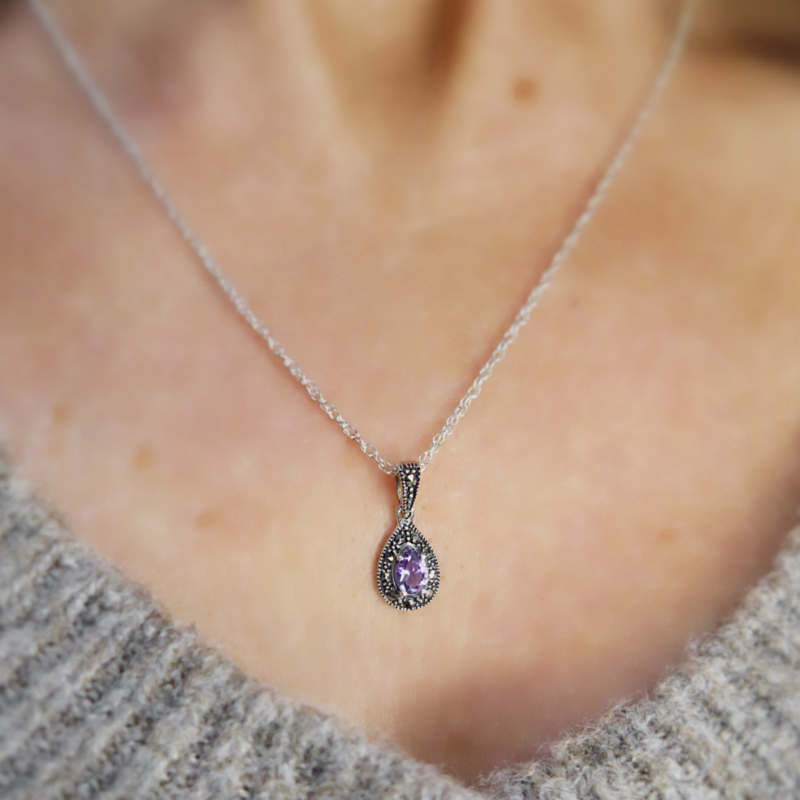 vintage style silver amethyst necklace on woman's neck
