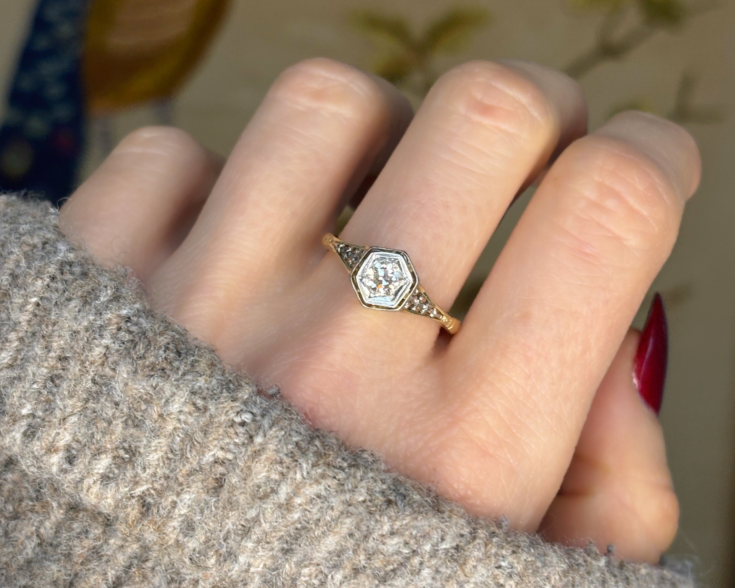 woman wearing edwardian diamond solitaire ring