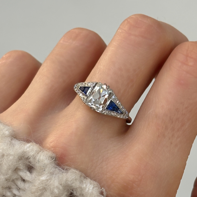antique Art Deco old mine cut diamond ring with calibre cut sapphires. 2.4ct centre stone, for sale in Leeds, UK, shown on a woman's hand