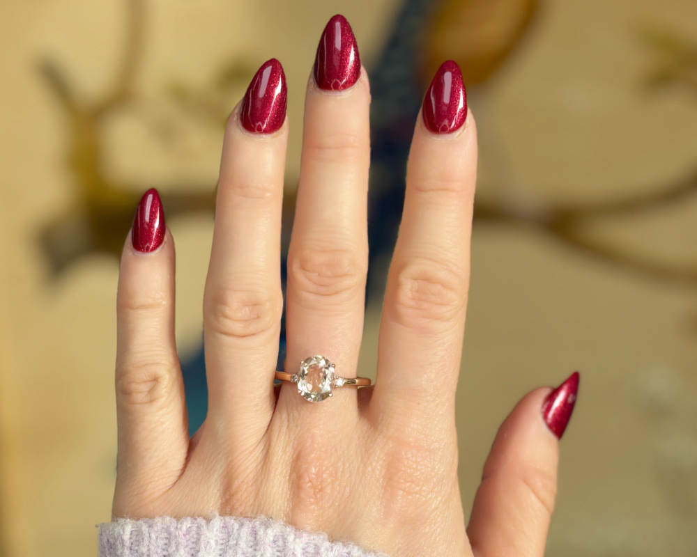 9ct rose gold morganite and diamond ring for sale in Leeds, shown on a woman's hand