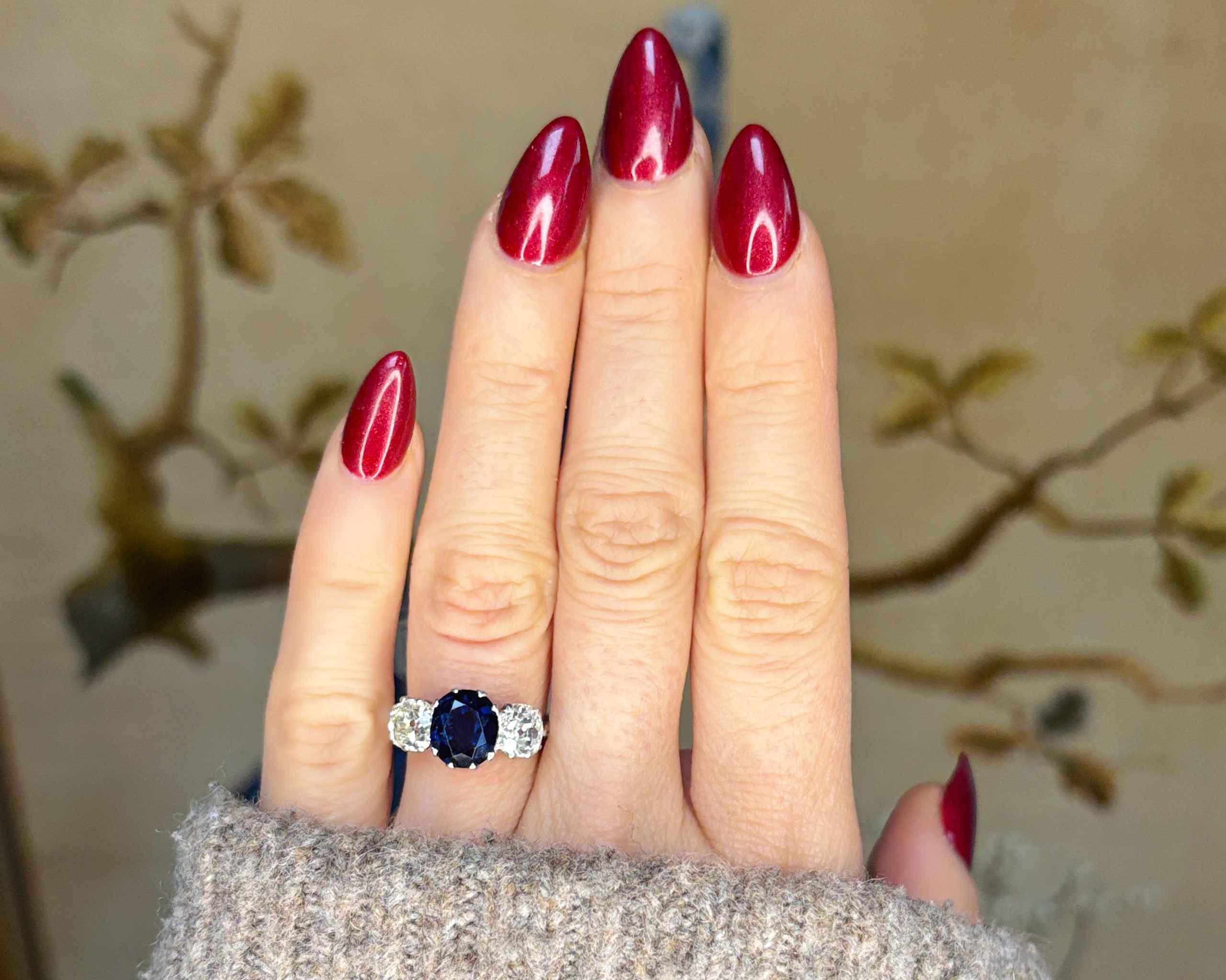 art deco sapphire ring on hand