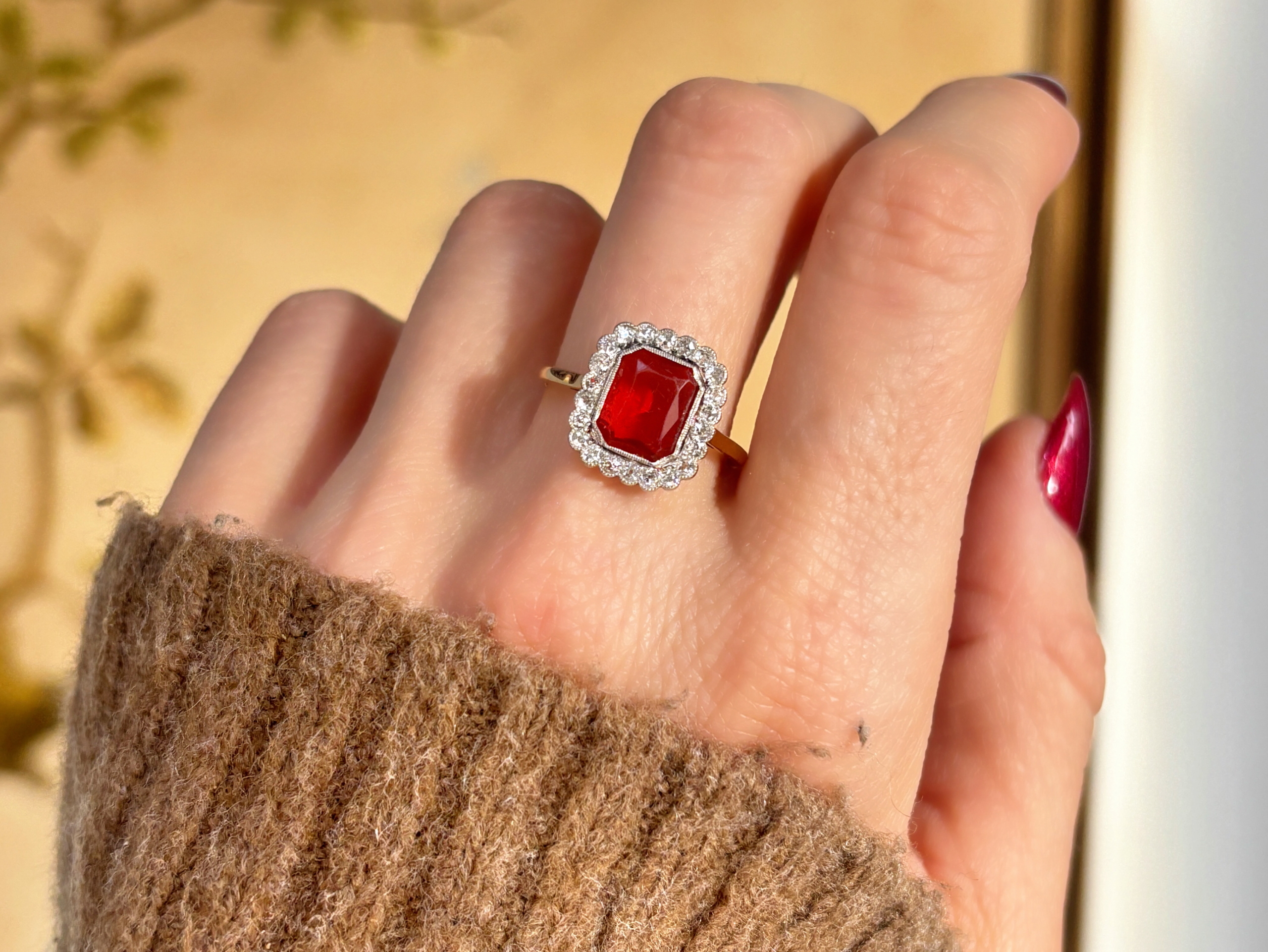 woman wearing fire opal ring