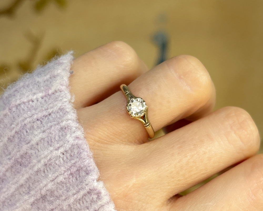 vintage diamond solitaire in 9ct yellow gold for sale in Leeds, shown on a woman's finger