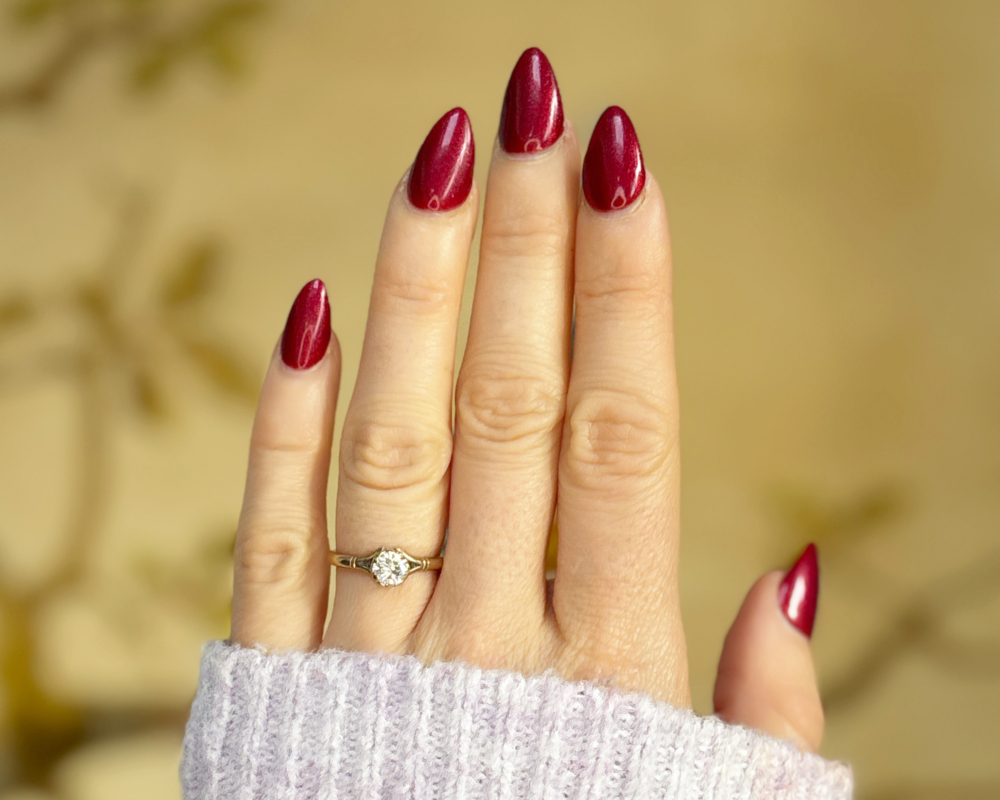 vintage diamond solitaire in 9ct yellow gold for sale in Leeds, shown on a woman's finger