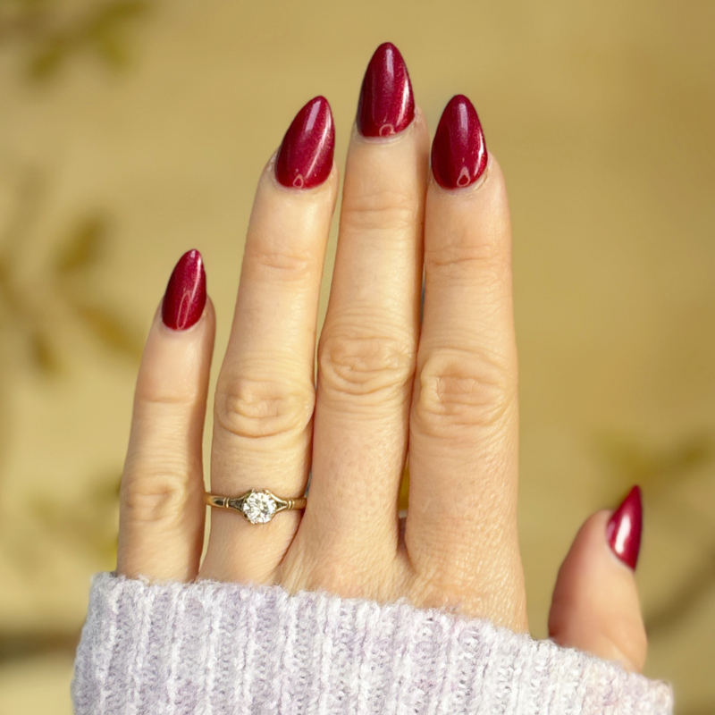 vintage diamond solitaire in 9ct yellow gold for sale in Leeds, shown on a woman's finger