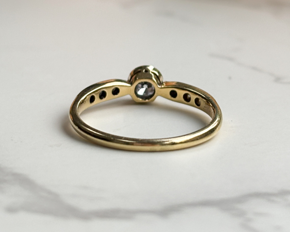 antique Art Deco 1930s diamond solitaire ring approx 0.25ct in 18ct yellow gold and platinum with a bezel setting, showing back of the ring