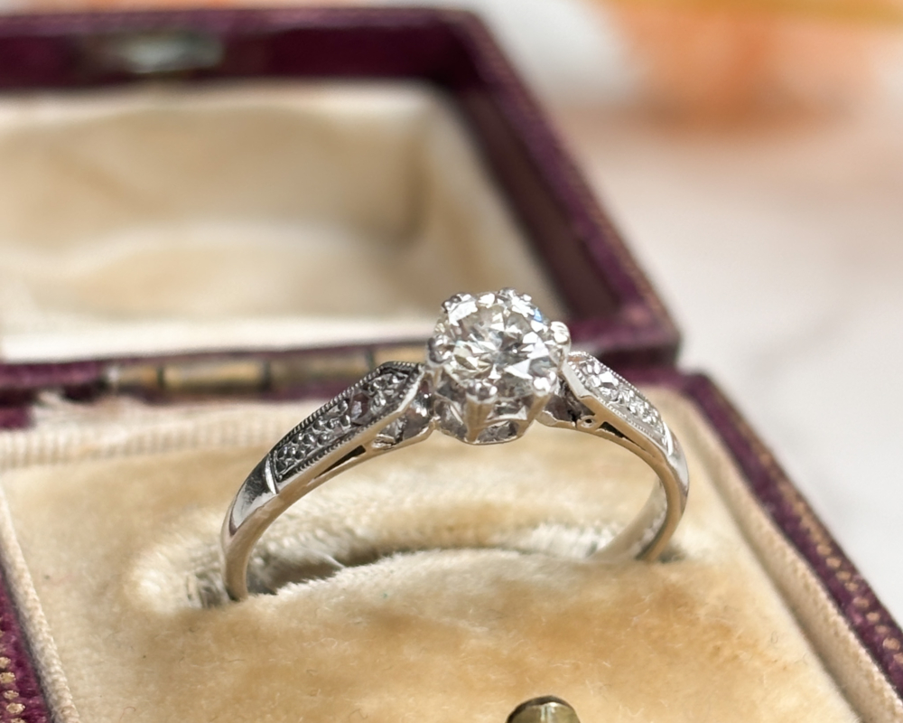antique Art Deco platinum diamond solitaire ring 0.3ct for sale in Leeds, shown in an antique brown box