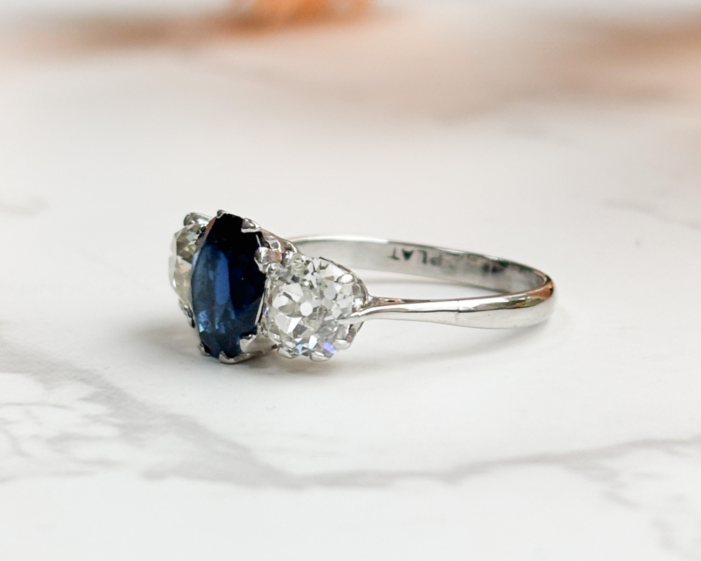 art deco sapphire and diamond three stone in platinum with 2ct sapphire and 1.2ct diamonds for sale in Leeds, showing side of the ring