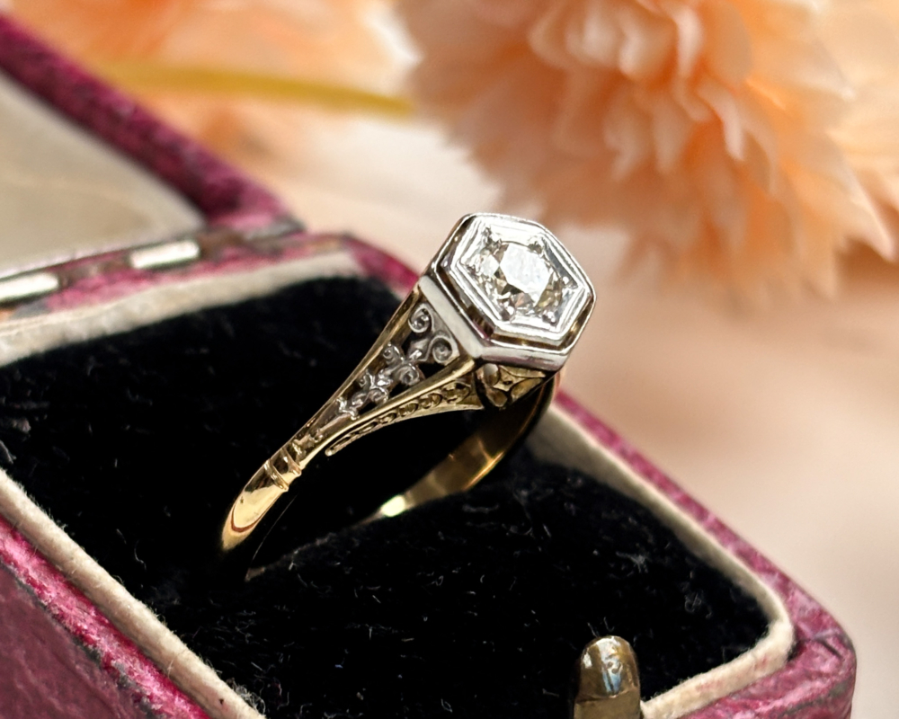 Antique Edwardian diamond solitaire ring in 18ct gold and platinum, bezel set with ornate filigree shoulders. Shown in an antique ring box. For sale in Leeds