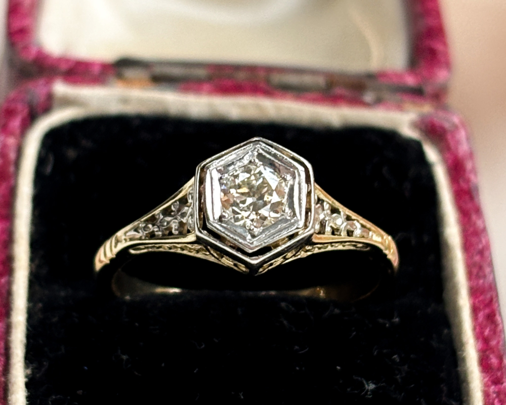 Antique Edwardian diamond solitaire ring in 18ct gold and platinum, bezel set with ornate filigree shoulders. Shown in an antique ring box. For sale in Leeds