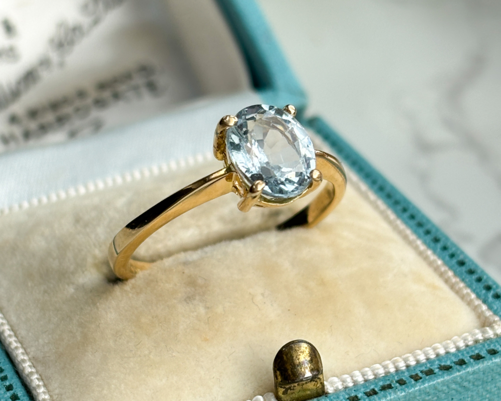 pre-owned 18ct gold aquamarine solitaire ring for sale in Leeds UK, shown in an antique blue box