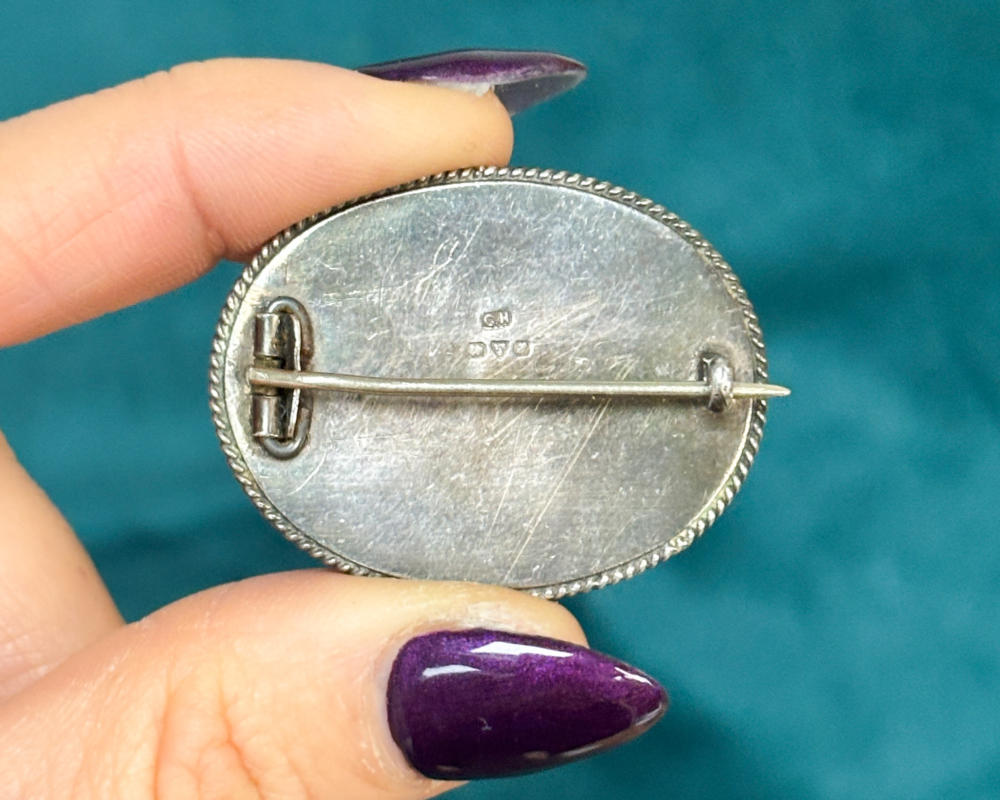 antique Charles Horner silver brooch with green cabochon stone dated Chester 1918, showing the back