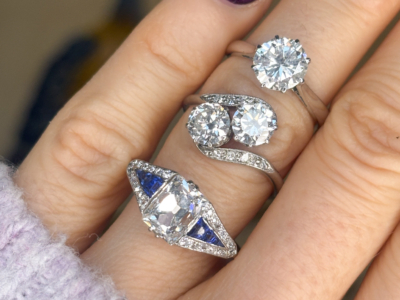 antique engagement rings on a finger