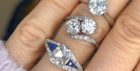 antique engagement rings on a finger