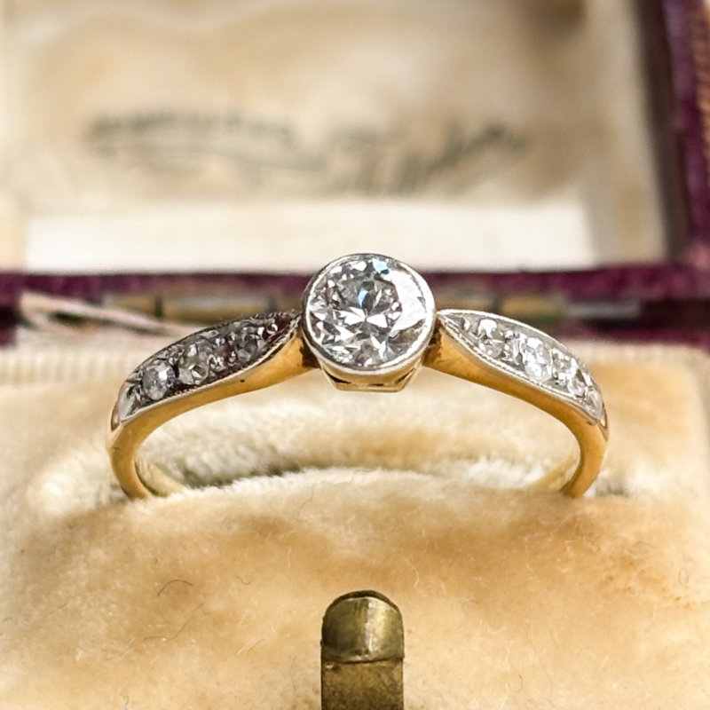 antique Art Deco 1930s diamond solitaire ring approx 0.25ct in 18ct yellow gold and platinum with a bezel setting, shown in an antique brown box