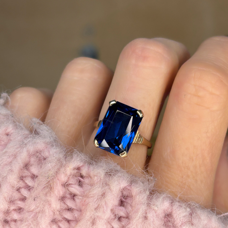 vintage blue stone statement ring in 9ct yellow gold hallmarks for 1970. For sale in Leeds, UK. Shown here on a woman's finger