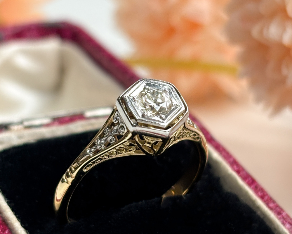 Antique Edwardian diamond solitaire ring in 18ct gold and platinum, bezel set with ornate filigree shoulders. Shown in an antique ring box. For sale in Leeds