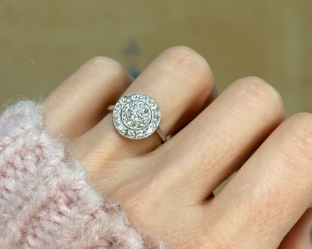 art deco circular diamond ring in 18ct white gold for sale in leeds, shown on a woman's finger