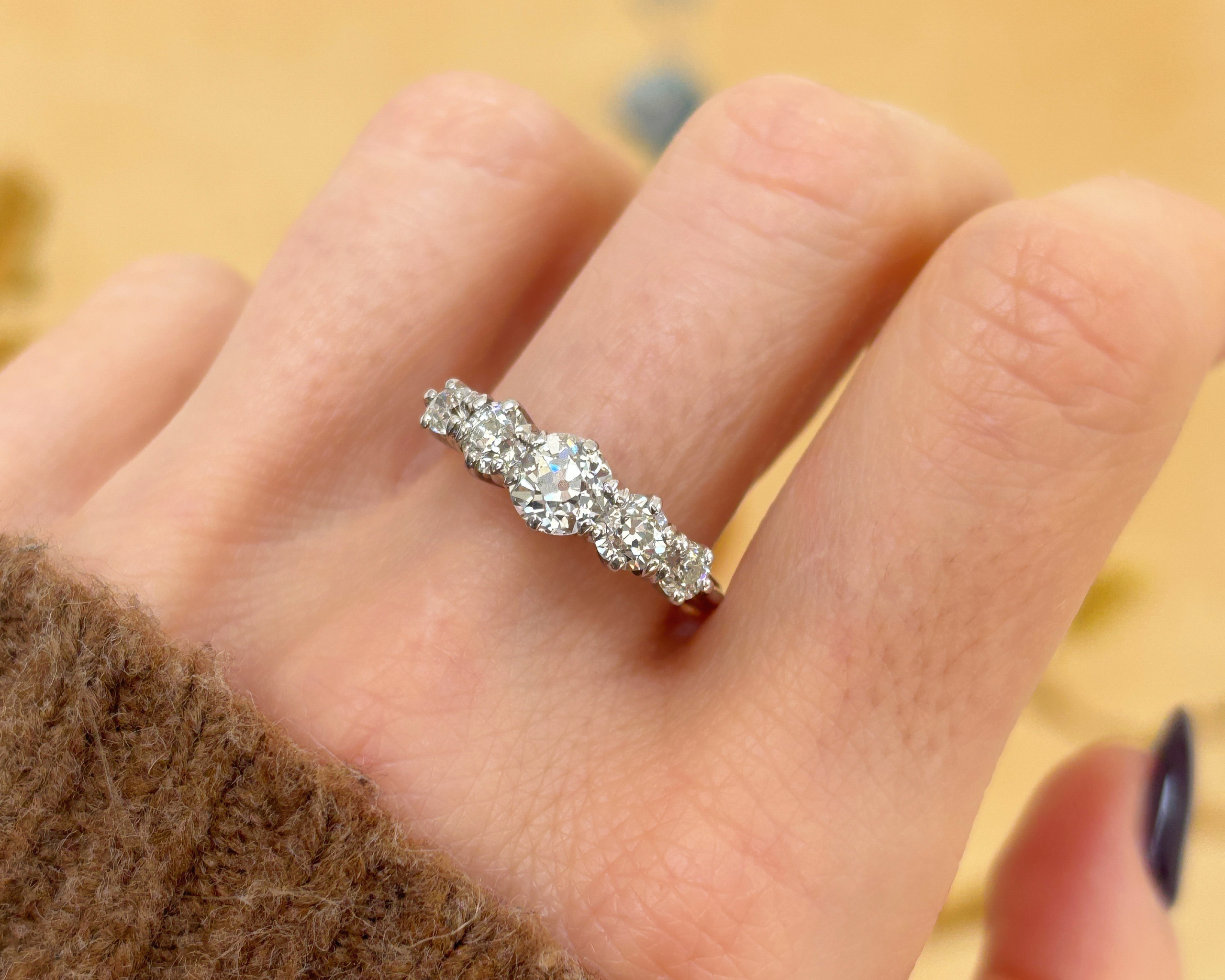 woman wearing 5 stone ring