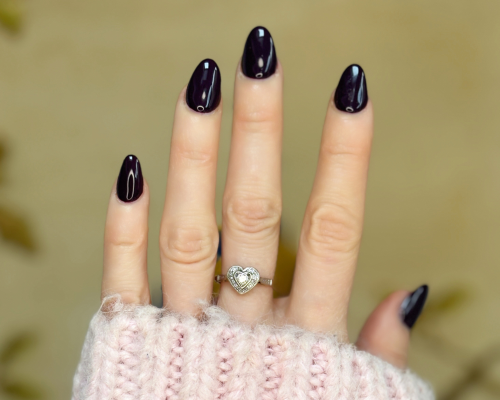 1940S diamond heart ring in 18ct yellow gold and platinum for sale in Leeds shown on a woman's hand
