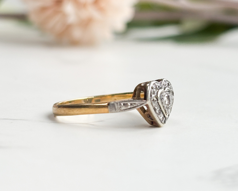 1940S diamond heart ring in 18ct yellow gold and platinum for sale in Leeds, shown in an antique pink box, showing side view