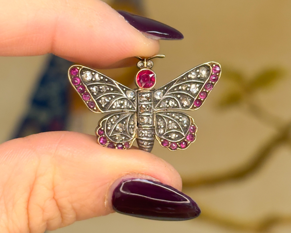 antique Victorian ruby and rose cut diamond butterfly brooch in silver and 14ct gold. For sale in Leeds