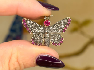 antique Victorian ruby and rose cut diamond butterfly brooch in silver and 14ct gold. For sale in Leeds