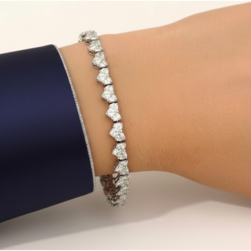vintage diamond tennis bracelet in 18ct white gold with 7ct heart shaped diamonds for sale in Leeds on model's wrist
