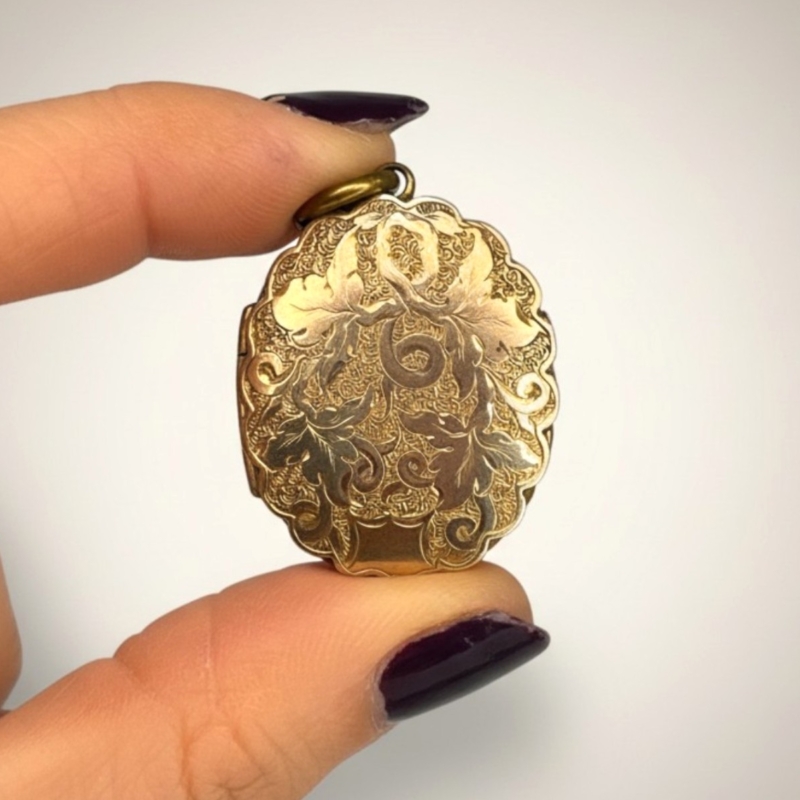 antique Edwardian fanily locket made from pinchbeck with scrolled chased detail