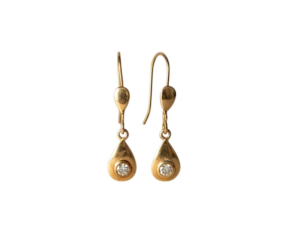 gold and diamond earrings flatlay vintage 18ct gold and diamond drop earrings for sale in Leeds
