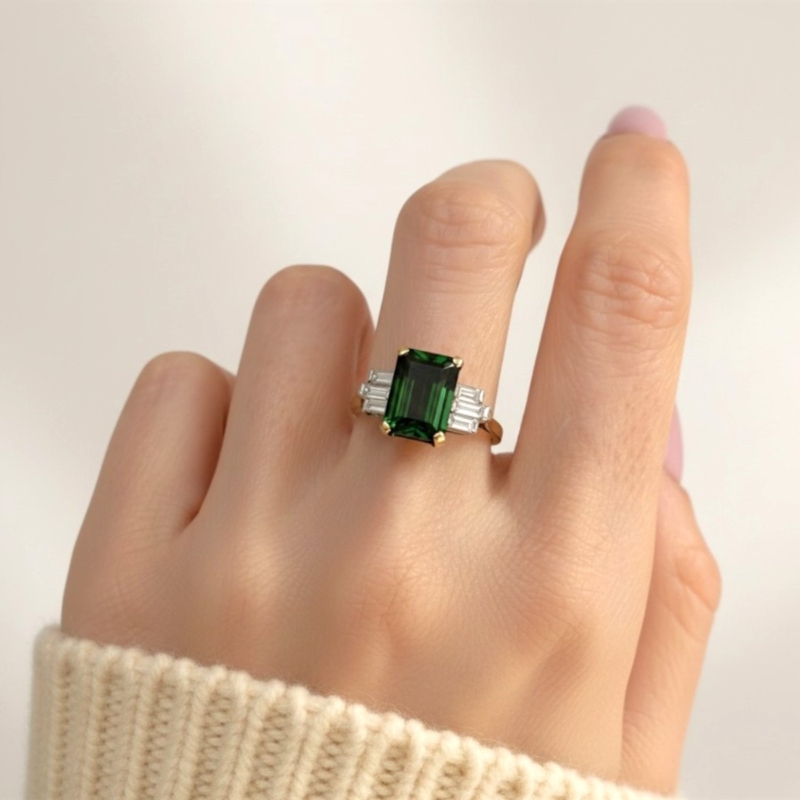 antique Art Deco green tourmaline and baguette diamond ring in 18ct yellow gold and platinum for sale in Leeds, on model's hand