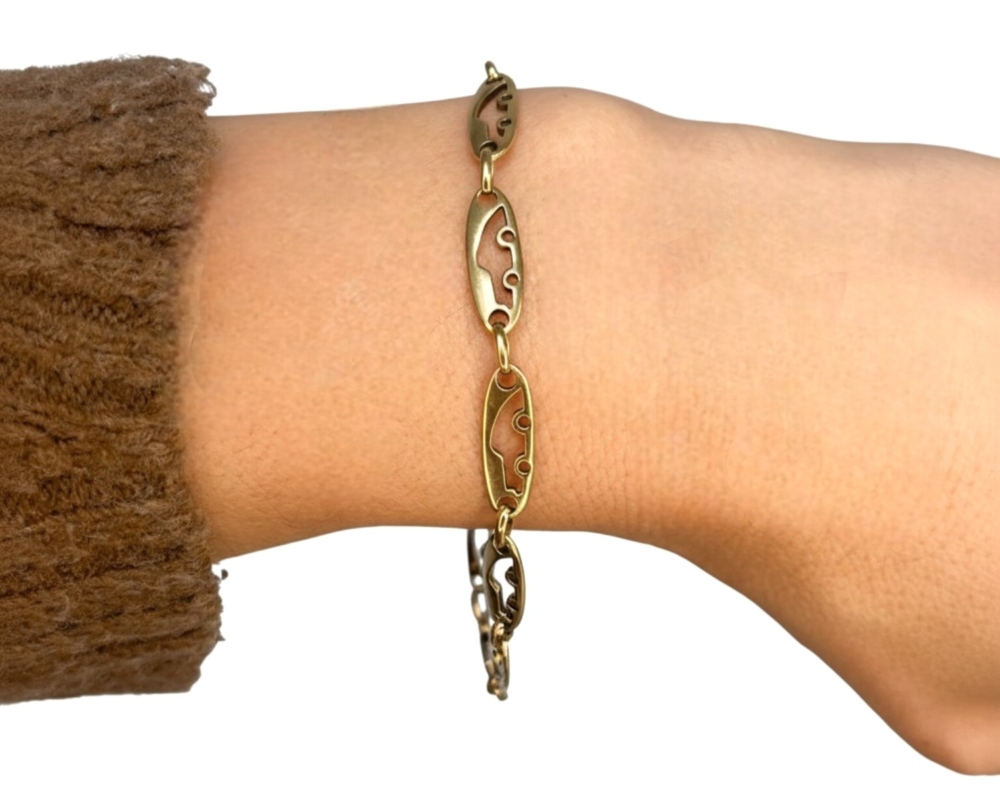 vintage 18ct gold bracelet with fancy links for sale in Leeds. shown on a wrist