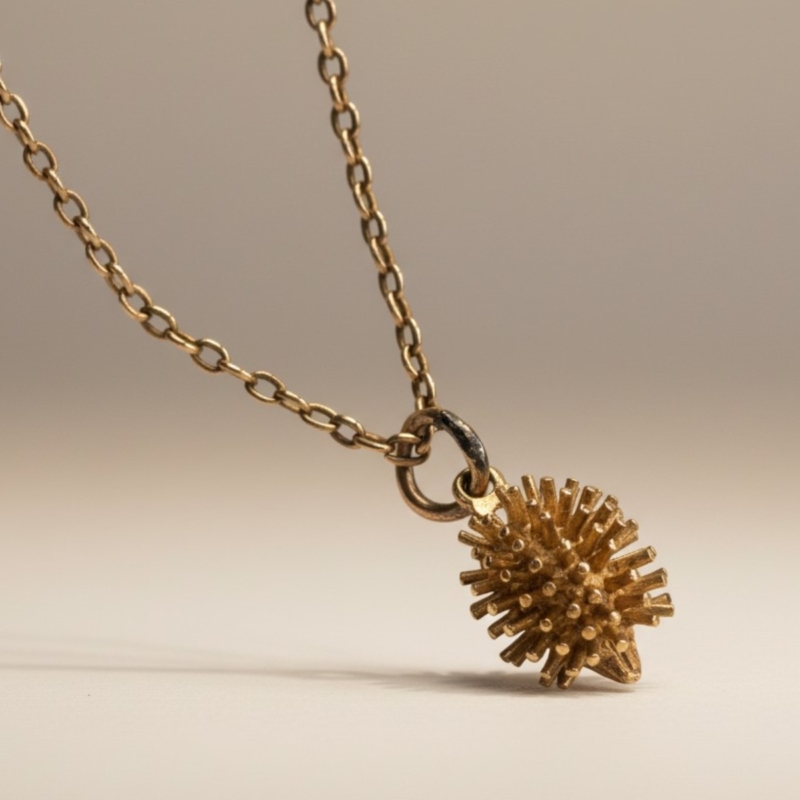 vintage 9ct gold hedgehog pendant on a 9ct gold chain