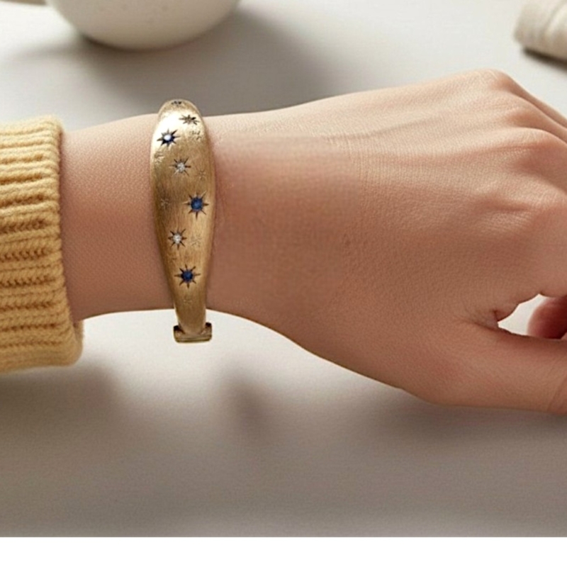 vintage sapphire and diamond bangle in 9ct gold circa 1960s for sale in Leeds, UK shown on model's wrist