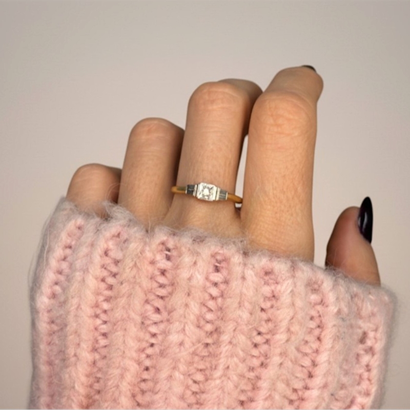 art deco diamond star set ring in 18ct yelow gold and platinum for sale in Leeds, UK on model's hand