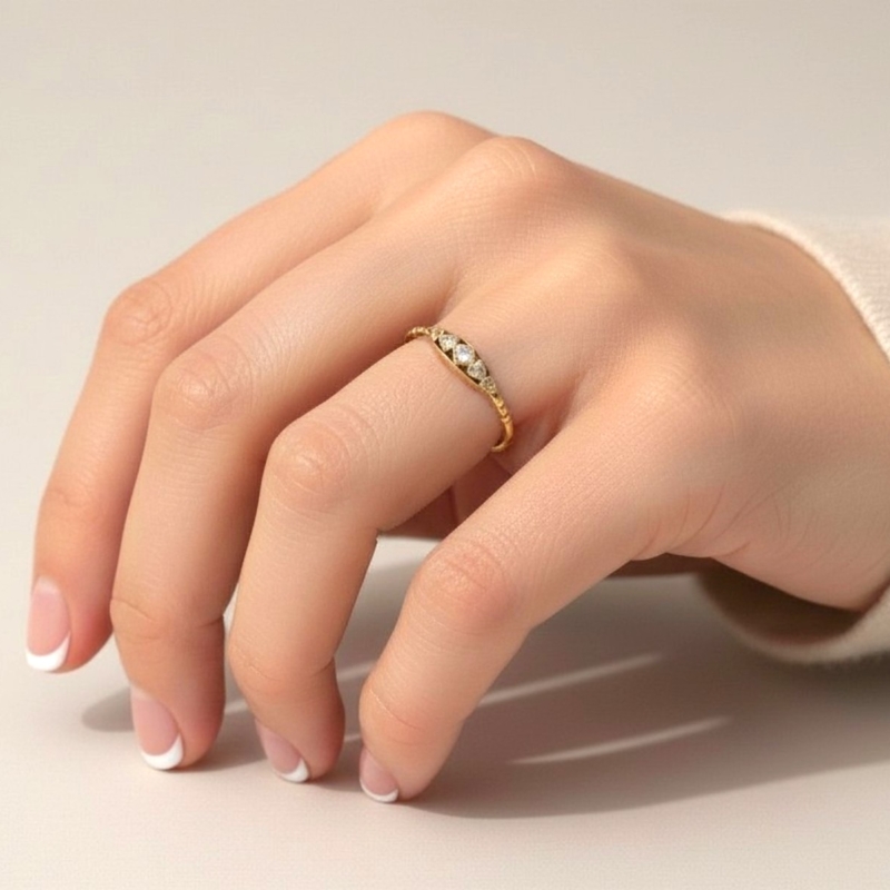 1930s diamond five stone ring in 18ct gold for sale in Leeds, UK, shown on a model's hand