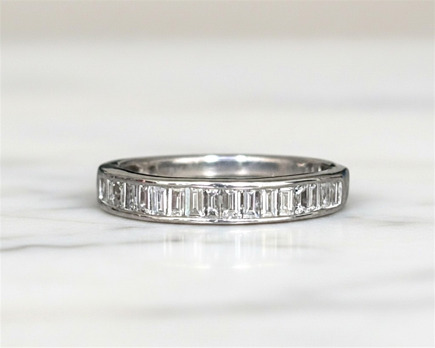 pre-owned baguette diamond half eternity ring in 18ct white gold for sale in Leeds