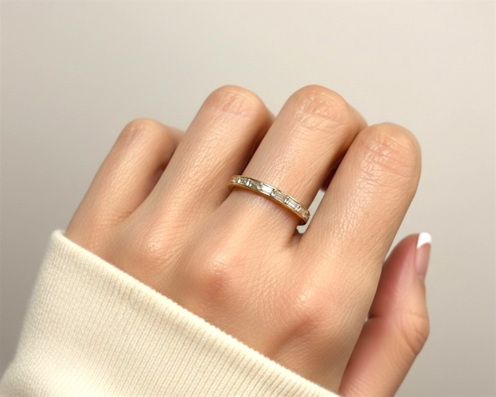 vintage baguette diamond half eternity ring in 14ct yellow gold for sale in Leeds, UK on model's hand