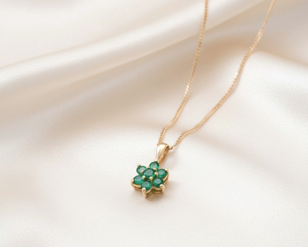 vintage style 9ct gold and emerald cluster pendant on a gold chain for sale in Leeds
